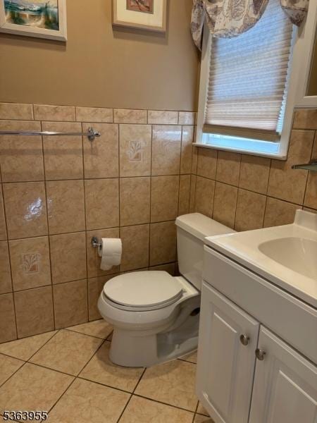 85 Stonehenge Ter, Clark Twp, NJ 07066 - bathroom with tile walls, vanity, and tile patterned flooring