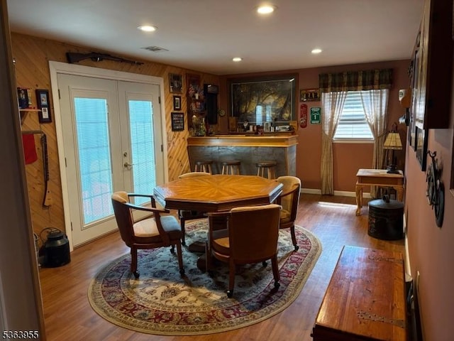 85 Stonehenge Ter, Clark Twp, NJ 07066 - dining space featuring a bar, wood finished floors, recessed lighting, and wooden walls