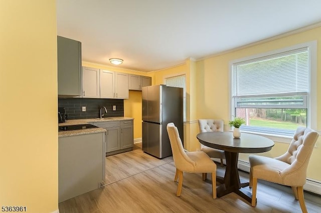 935C E Front St Unit C, Plainfield City, NJ 07062 - kitchen with freestanding refrigerator, light wood finished floors, tasteful backsplash, gray cabinets, and light stone countertops