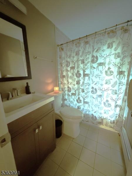 935C E Front St Unit C, Plainfield City, NJ 07062 - full bathroom featuring vanity, tile patterned flooring, and a shower with shower curtain