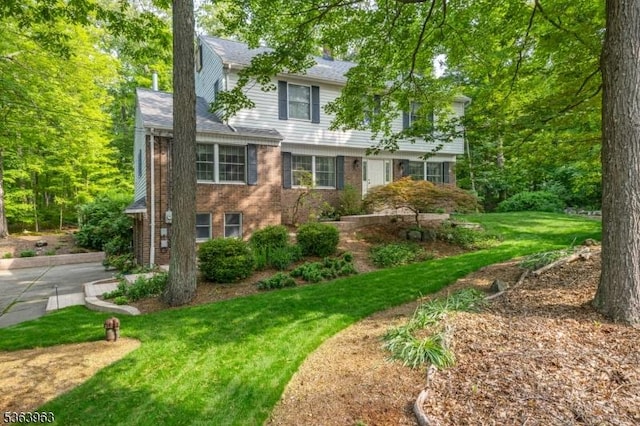 46 Deerfield Dr, Hardyston Twp, NJ 07416 - view of front of property featuring brick siding, a front lawn, and roof with shingles