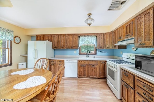46 Deerfield Dr, Hardyston Twp, NJ 07416 - kitchen featuring white appliances, under cabinet range hood, brown cabinets, and light countertops
