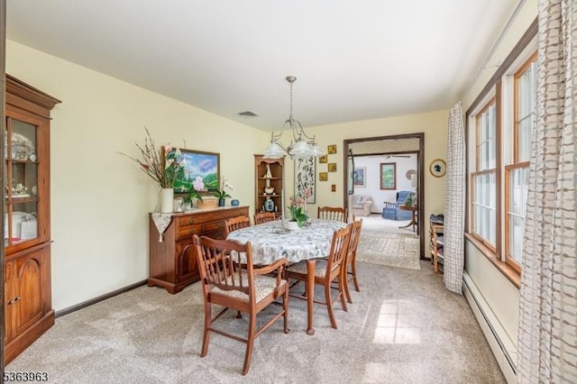 46 Deerfield Dr, Hardyston Twp, NJ 07416 - dining area with a baseboard heating unit, a chandelier, and light colored carpet