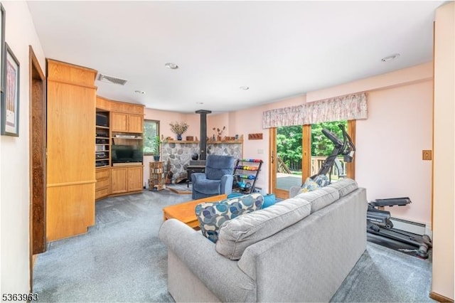 46 Deerfield Dr, Hardyston Twp, NJ 07416 - carpeted living area featuring a wood stove and baseboard heating