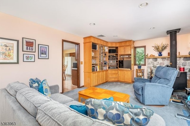 46 Deerfield Dr, Hardyston Twp, NJ 07416 - living room with a wood stove, light carpet, and recessed lighting
