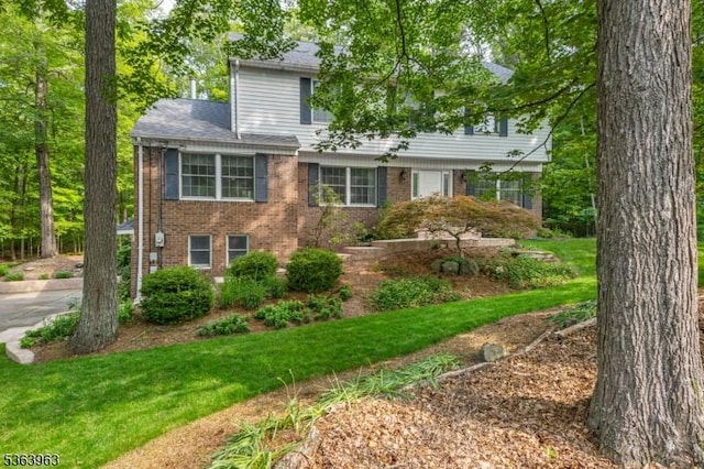 46 Deerfield Dr, Hardyston Twp, NJ 07416 - view of front facade featuring brick siding and a front yard