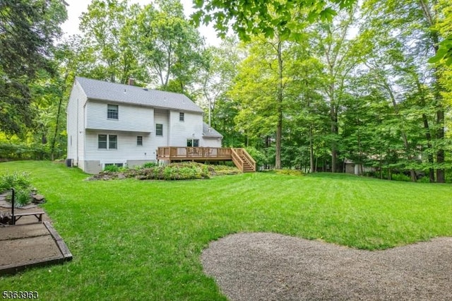46 Deerfield Dr, Hardyston Twp, NJ 07416 - view of green lawn with a wooden deck and stairway
