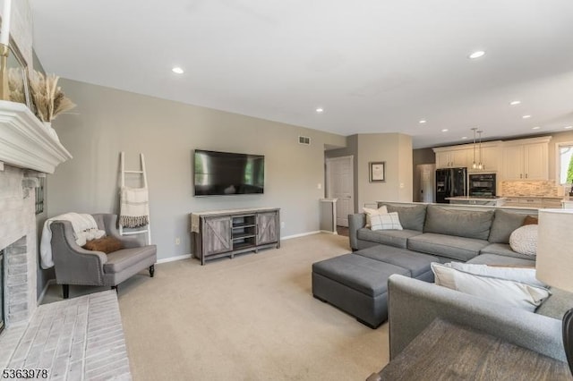 1611 Adams Dr, Greenwich Twp, NJ 08886 - living room featuring a fireplace, light colored carpet, and recessed lighting