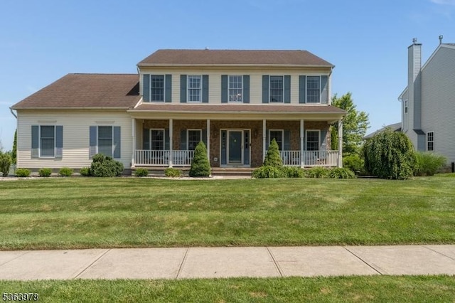 1611 Adams Dr, Greenwich Twp, NJ 08886 - colonial-style house with a porch and a front yard