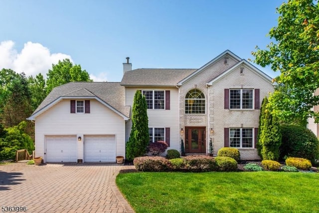 6 Skyview Dr, Rockaway Twp, NJ 07866 - view of front facade with a chimney, a front lawn, decorative driveway, and brick siding