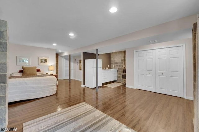 143 Canal Way, Hackettstown Town, NJ 07840 - bedroom with wood finished floors, recessed lighting, and freestanding refrigerator