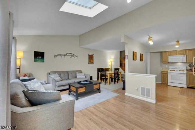 143 Canal Way, Hackettstown Town, NJ 07840 - living area with light wood finished floors, stairs, and a skylight