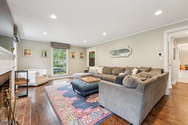 64 Mckinley Ave, West Caldwell Twp, NJ 07006 - living area featuring recessed lighting, wood finished floors, crown molding, and a brick fireplace