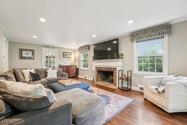 64 Mckinley Ave, West Caldwell Twp, NJ 07006 - living room with wood finished floors, ornamental molding, a brick fireplace, and recessed lighting