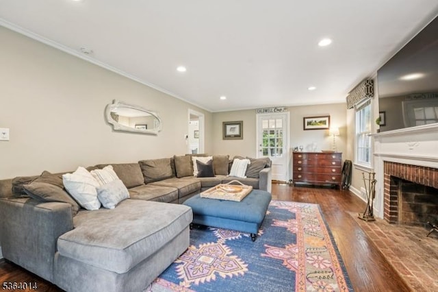 64 Mckinley Ave, West Caldwell Twp, NJ 07006 - living area featuring wood finished floors, ornamental molding, recessed lighting, and a fireplace