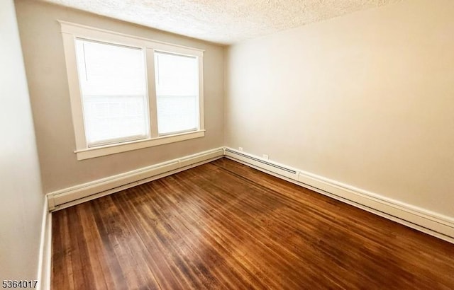 191 Summit Ave, Phillipsburg Town, NJ 08865 - spare room with a textured ceiling, dark wood finished floors, and a baseboard heating unit