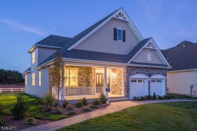 6 Leidl Cir, Hillsborough Twp, NJ 08844 - view of front of home with covered porch, stone siding, an attached garage, and roof with shingles