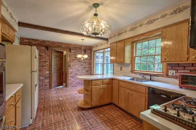 192 Carol Jean Way, Branchburg Twp, NJ 08876 - kitchen with a chandelier, brick patterned floors, freestanding refrigerator, brick wall, and light countertops