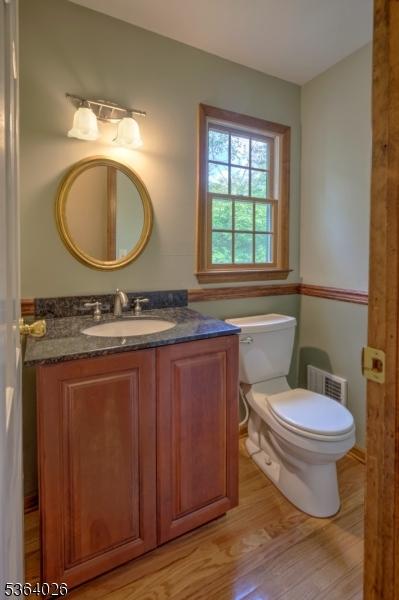 192 Carol Jean Way, Branchburg Twp, NJ 08876 - half bathroom with wood finished floors and vanity