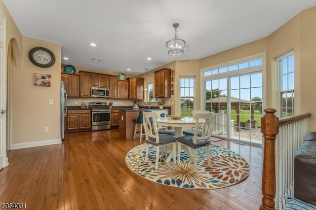 13 Highlands Way, Lopatcong Twp, NJ 08865 - dining room featuring dark wood-type flooring, recessed lighting, a chandelier, and arched walkways