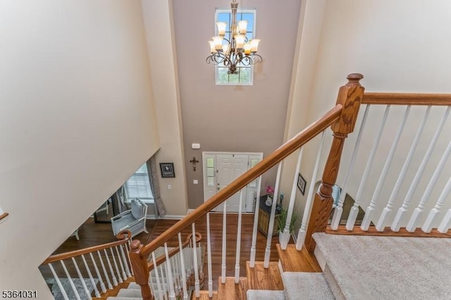 13 Highlands Way, Lopatcong Twp, NJ 08865 - stairway featuring a chandelier, wood finished floors, and a high ceiling