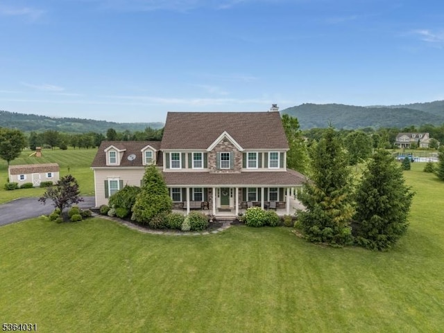 13 Highlands Way, Lopatcong Twp, NJ 08865 - view of front of house with a porch, a front lawn, and a mountain view