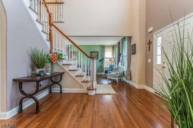 13 Highlands Way, Lopatcong Twp, NJ 08865 - foyer featuring stairs, wood finished floors, plenty of natural light, and a high ceiling