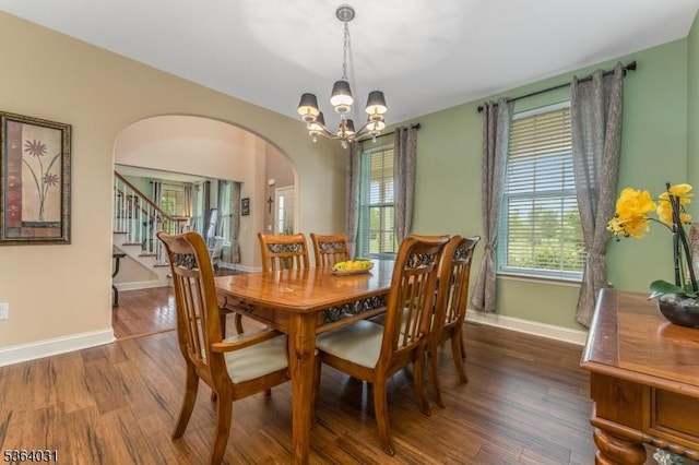 13 Highlands Way, Lopatcong Twp, NJ 08865 - dining area featuring arched walkways, dark wood-style floors, stairway, and a chandelier