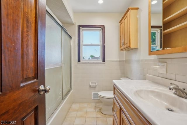 129 Jockey Hollow Way, Union Twp, NJ 07083 - bathroom with tile walls, tile patterned flooring, vanity, enclosed tub / shower combo, and wainscoting