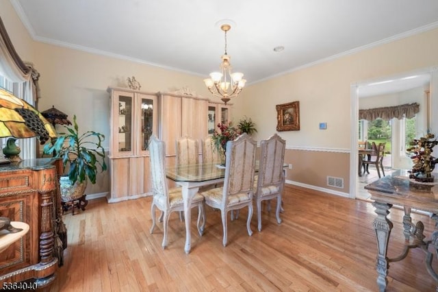 31 Deer Path, Hillsborough Twp, NJ 08844 - dining room with a chandelier, light wood-style floors, and ornamental molding