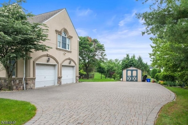 31 Deer Path, Hillsborough Twp, NJ 08844 - garage featuring a storage unit and curved driveway