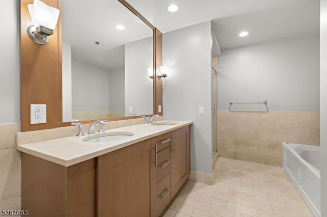 1025 Maxwell Ln Unit 1209, Hoboken City, NJ 07030 - full bathroom with a garden tub, double vanity, tile patterned flooring, a stall shower, and recessed lighting