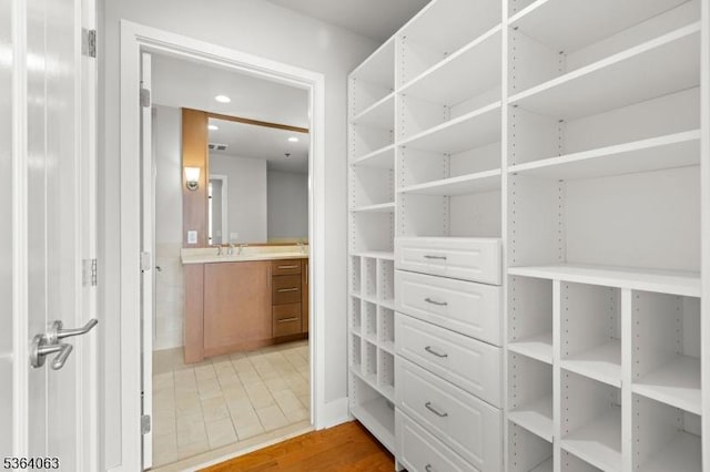 1025 Maxwell Ln Unit 1209, Hoboken City, NJ 07030 - walk in closet with light wood-style floors and a sink