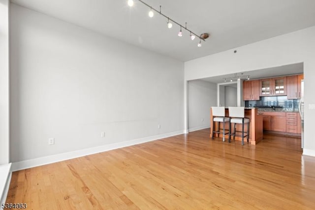 1025 Maxwell Ln Unit 1209, Hoboken City, NJ 07030 - living area with rail lighting and light wood-type flooring