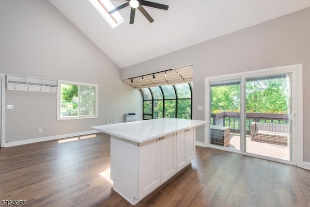 2 Falkenstein Dr Unit 10, Vernon Twp, NJ 07462 - kitchen featuring a ceiling fan, white cabinets, plenty of natural light, high vaulted ceiling, and light countertops