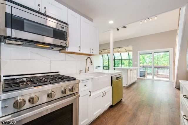 2 Falkenstein Dr Unit 10, Vernon Twp, NJ 07462 - kitchen featuring stainless steel appliances, white cabinetry, light countertops, and recessed lighting
