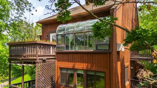 2 Falkenstein Dr Unit 10, Vernon Twp, NJ 07462 - view of property exterior with a deck and a sunroom