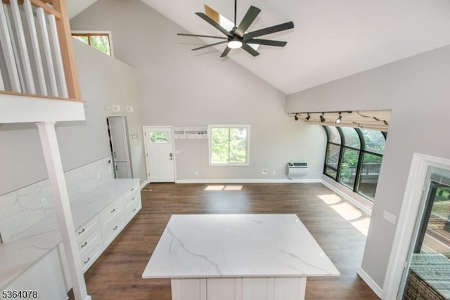 2 Falkenstein Dr Unit 10, Vernon Twp, NJ 07462 - unfurnished living room with a ceiling fan, high vaulted ceiling, healthy amount of natural light, dark wood finished floors, and a wall mounted AC