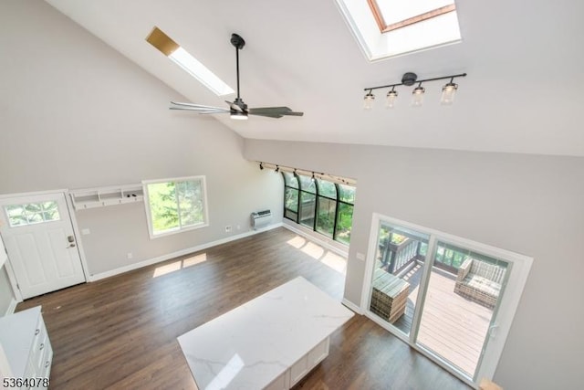 2 Falkenstein Dr Unit 10, Vernon Twp, NJ 07462 - unfurnished living room featuring high vaulted ceiling, a skylight, dark wood-type flooring, and ceiling fan