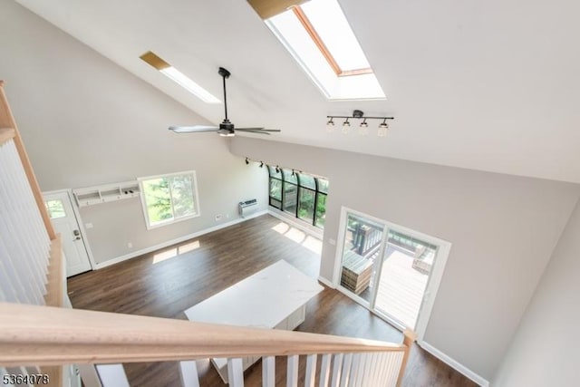 2 Falkenstein Dr Unit 10, Vernon Twp, NJ 07462 - stairway featuring a skylight, high vaulted ceiling, wood finished floors, a ceiling fan, and an AC wall unit