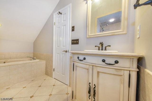 2 Falkenstein Dr Unit 10, Vernon Twp, NJ 07462 - bathroom with vanity, a garden tub, vaulted ceiling, tile patterned floors, and a wainscoted wall