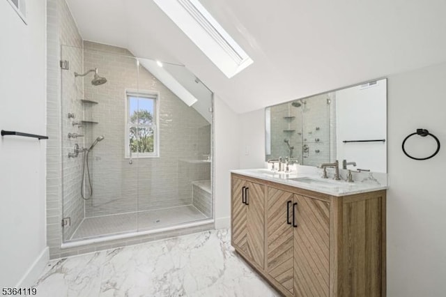 24 Tuers Pl, Montclair Twp, NJ 07043 - bathroom featuring a skylight, vaulted ceiling, a shower stall, double vanity, and marble finish floors