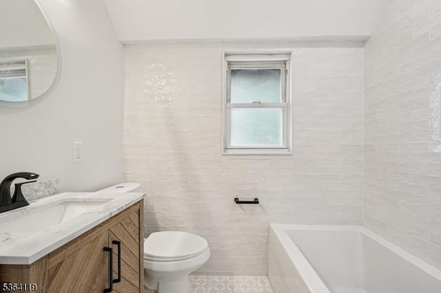 24 Tuers Pl, Montclair Twp, NJ 07043 - full bath featuring a tub to relax in, vanity, tile patterned flooring, and tile walls