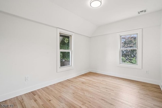 24 Tuers Pl, Montclair Twp, NJ 07043 - spare room featuring healthy amount of natural light, light wood-type flooring, and lofted ceiling