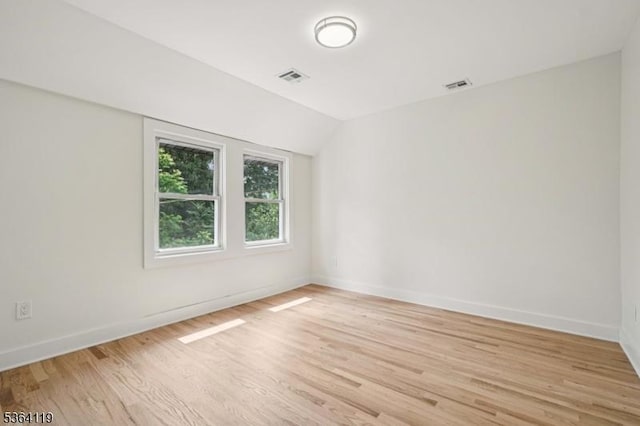 24 Tuers Pl, Montclair Twp, NJ 07043 - spare room with light wood finished floors and vaulted ceiling