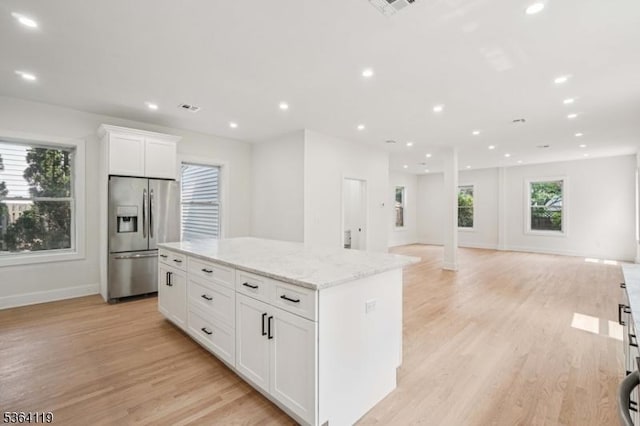 24 Tuers Pl, Montclair Twp, NJ 07043 - kitchen featuring stainless steel refrigerator with ice dispenser, a center island, light wood-style flooring, white cabinetry, and recessed lighting