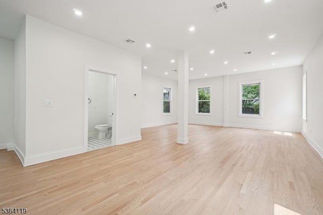 24 Tuers Pl, Montclair Twp, NJ 07043 - unfurnished living room with light wood-style flooring, recessed lighting, and decorative columns