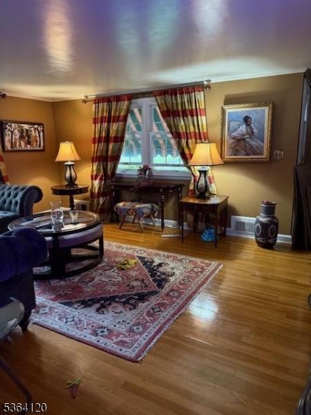 1221 Grant Ave, Plainfield City, NJ 07060 - living room featuring wood finished floors and baseboards