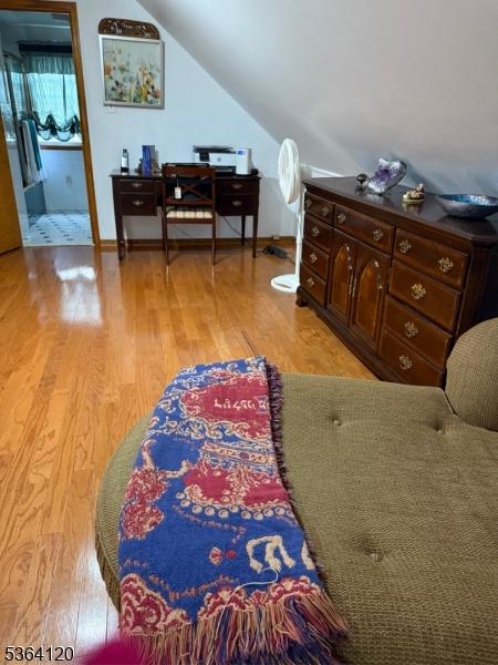 1221 Grant Ave, Plainfield City, NJ 07060 - bedroom with light wood-style floors and lofted ceiling