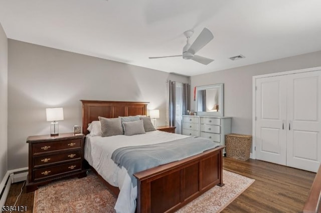 198 Pittsford Way, New Providence Boro, NJ 07974 - bedroom with baseboard heating, dark wood-style floors, ceiling fan, and a closet